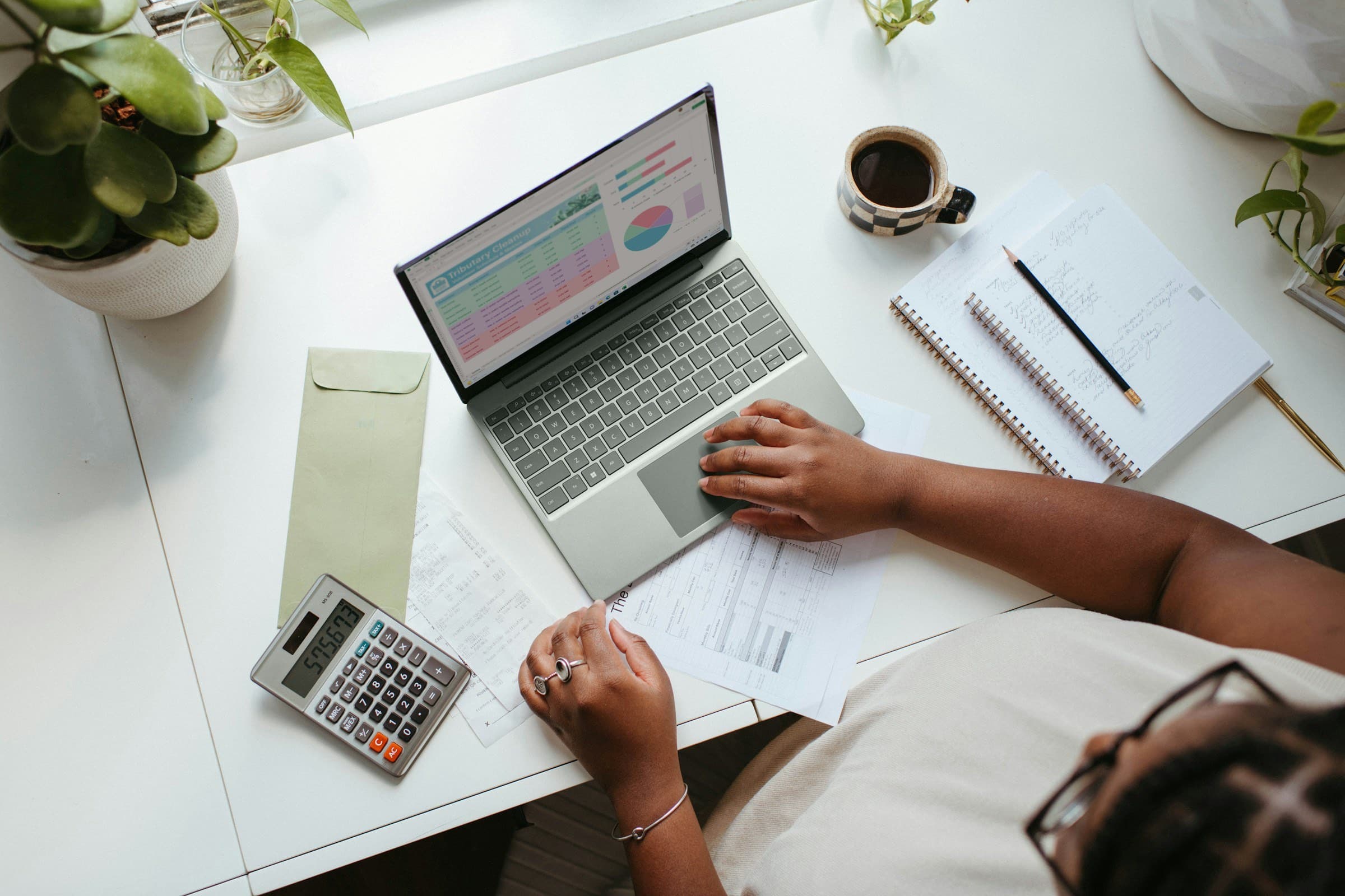 An accountant working through figures on a laptop